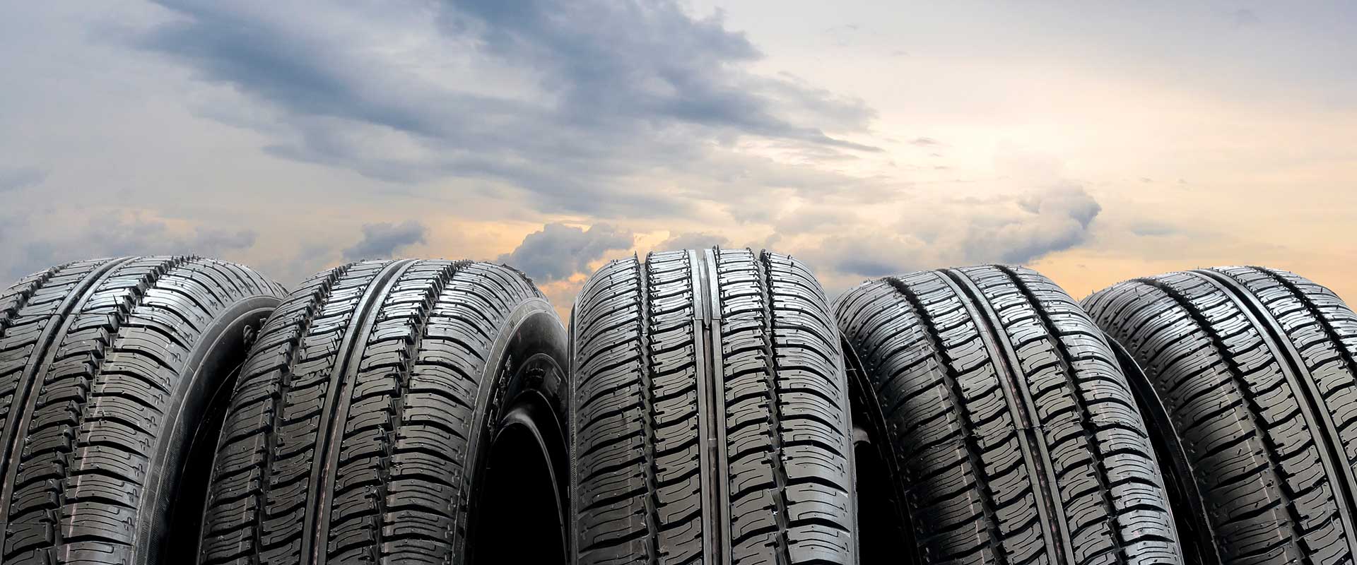 5 tires with a early morning sky background